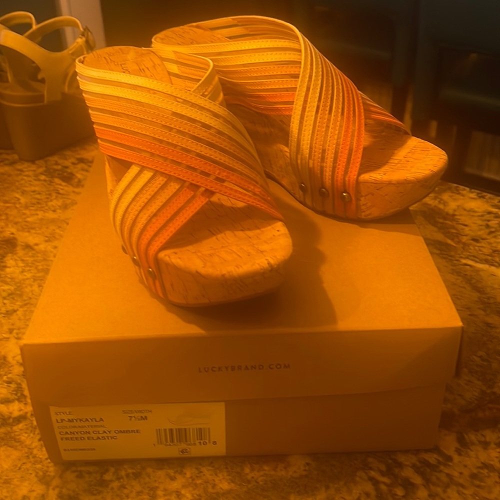 Lucky Brand sandals. Size 7 1/2 worn once. Shades of orange and beige. Like new